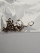 selection of mostly 9ct gold charm loops, 2g