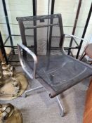 A late 20th Century Charles Eames Vitra office desk chair, aluminium supports with black mesh cover,