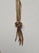 9ct yellow gold double strand herringbone necklace knotted at base to give tassel effect, marked 375
