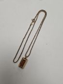 9ct yellow gold neckchain hung with a 9ct gold pendant in the form of a bullion bar, approx 4.33g