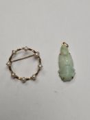 Chinese Jade pendant depicting a Buddha and yellow metal circular twisted brooch set with seed pearl