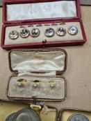 Set of 3 gilt dress studs in fitted case, marked Asprey, a case buttons, various coins and bank note
