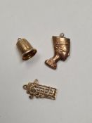 3 9ct gold charms, Nefertiti, music and a thimble, 3.69