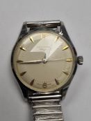 Longines; a gents stainless steel Longines wristwatch with champagne dial, golden baton markers, num