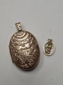 Large oval gold front and back locket with allover floral decoration 4.5 x 3.5cm, gross 20.9g and a