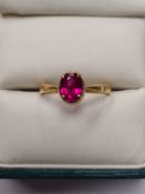 22ct yellow gold band ring set with oval faceted ruby, 2.83g marked 22ct, size P.
