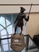 A bronze statue of man holding staff and sword, possibly George Washington on granite base, 43.5cms