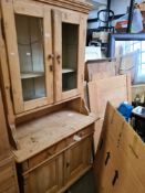 An old pine kitchen dresser having two drawers with glazed top, 100cms