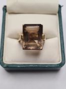 Unmarked yellow gold cast ring, possibly 18ct, set with large step cut smokey topaz, size P, 14.8g a