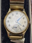 Vintage Garrard gents wristwatch, marked 375, champagne dial with numbers, outside seconds track, su