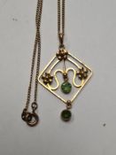 9ct gold fine neckchain hung with a9ct gold pendant set with green stones, on pendant with applied f