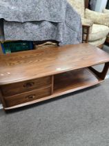 An Ercol elm TV/media unit having two drawers beside open shelf, 124.5cms