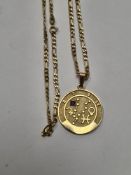 9ct yellow gold figaro design necklace hung with 9ct circular Chinese pendant, both marked 5.6g