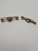 Two Victorian bar brooches, possibly 15ct, both unmarked, one with central oval aquamarine, the othe