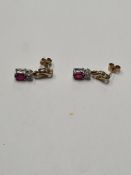 Pair of pretty 9ct yellow gold drop earrings with round cut diamond above oval cut ruby, 2cm drop, a