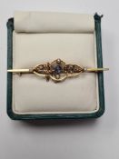 Antique 15ct yellow gold bar brooch with applied openwork panel inset seed pearls and central round