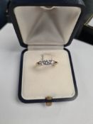 18ct yellow gold diamond trilogy ring, central diamond approx 0.25 carat, the other two approx 0.14