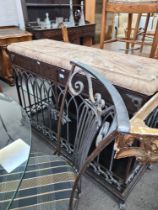 A modern decorative metalwork sideboard having pierced arched decoration with marble style top