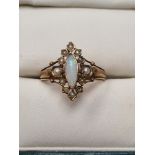Antique 9ct yellow gold dress ring set with marquise cabouchon opal framed with panels inset with se