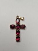 9ct yellow gold cross pendant inset with 6 oval cut claw mounted garnets, marked 375, 4cm x 2cm, inc