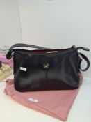 A Radley black leather handbag and protective drawstring Radley cover