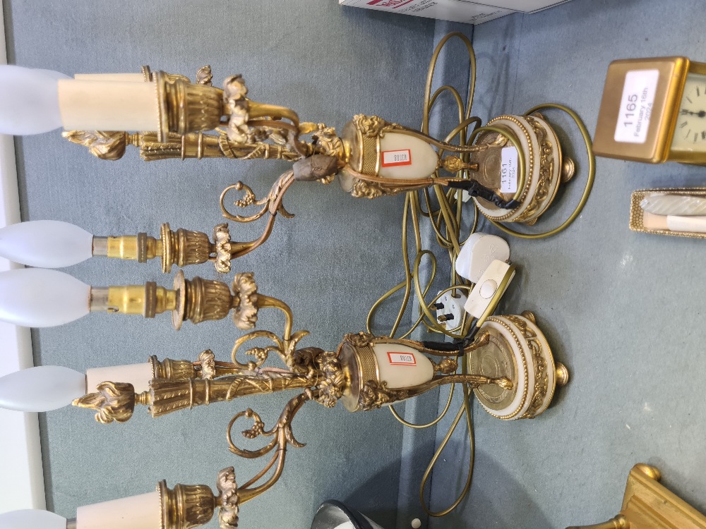 A pair of early 20th Century, French gilt metal and alabaster lamps each having 3 sconces, 40cm