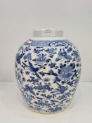 A Chinese blue and white ginger jar having allover decoration of birds and butterflies, four charact