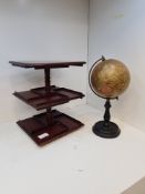 An old Geographia 6 inch Terrestrial globe on ebonised stand and a small mahogany table top revolvin