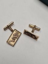 Pair of 9ct yellow gold cufflinks, rectangular panels decorated with Chinese dragons, one AF, marked