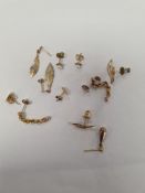 Quantity of 9ct and yellow metal earrings incl. ropetwist examples, pair of leaf design drop earring