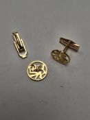 Pair of 18ct yellow gold /cufflinks, with circular panels depicting Chinese character marks AF, one