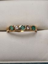 18ct yellow gold band ring inset with emeralds and diamonds, 5 round cut stones, size O, approx 3g,