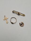 9ct yellow gold brooch set with clear stone, 9ct gold cross pendant, 9ct gold horse shoe and 9ct gol