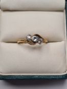 Antique 18ct yellow gold crossover design ring, with central rubover set diamond with illusion set e