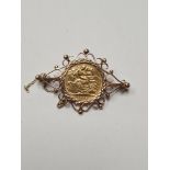 22ct gold half sovereign, dated 1912, in 9ct yellow gold decorative brooch mount, marked 375, with s