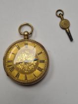 18ct gold cased pocket watch with golden dial, floral decoration, blank cartouche, and Roman numeral
