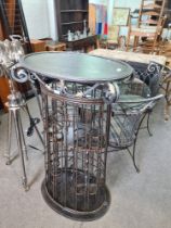 A modern oval metalwork drinks cabinet having two doors, height 125cms