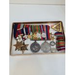 A mounted Medal group of 4 to include World War II War Medal, 1939-45 Star, Burma Star and a World W