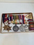 A mounted Medal group of 4 to include World War II War Medal, 1939-45 Star, Burma Star and a World W