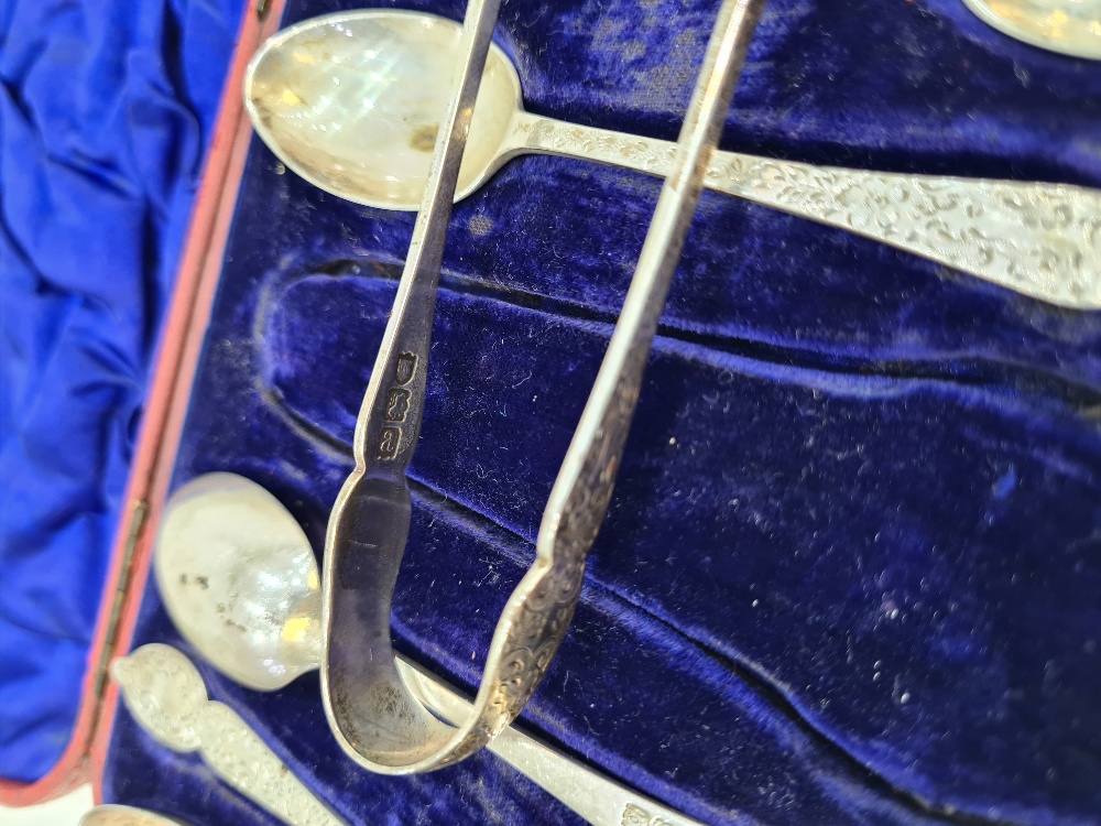 A cased set of Victorian silver teaspoons and sugar tongs. The handles being ornate and decorative, - Image 3 of 6