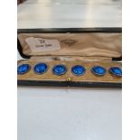 A cased set of six pretty blue enamel and silver buttons by James Fenton, Birmingham 1910. The ename