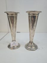 A pair of Edwardian silver trumpet vases, weighted on a raised pedestal base. Hallmarked Birmingham