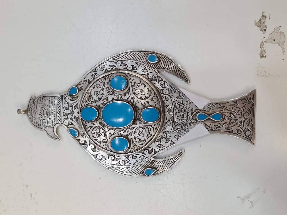 A beautiful white metal and blue stone details mirror/pendant in the form of a bird. A very ornate p