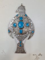 A beautiful white metal and blue stone details mirror/pendant in the form of a bird. A very ornate p