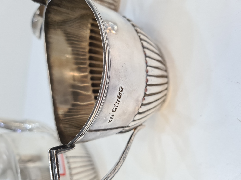 A silver Victorian tea service by Walker and Hall, having half reeded body, comprising of a tea serv - Image 6 of 6