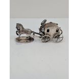 A novelty silver Victorian horse and cart having sweet design of figures inside the carriage. Detail