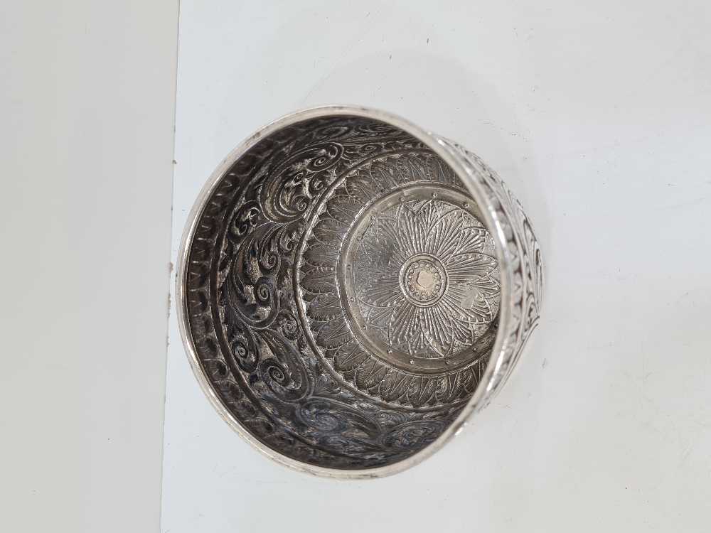 A heavily embossed Victorian Silver bowl having foliage scrolls in relief. The base engraved with or - Image 2 of 6