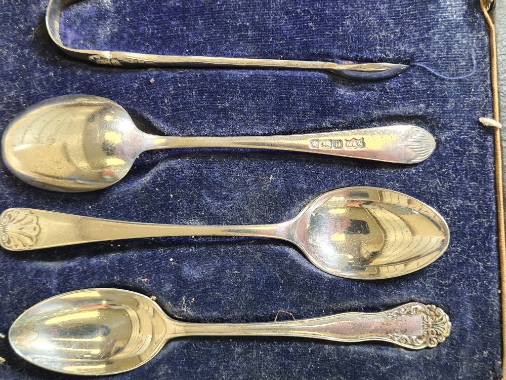 A cased set of decorative silver spoons and tongs, two silver toast racks by Hukin and Heath, a pair - Image 3 of 10