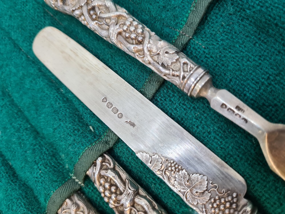 A set of six Victorian silver fruit knives and forks, with heavily embossed handles of vines and gra - Image 11 of 12