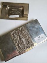A silver quality cigarette box marked Sterling 925, having embossed central design on the lid of fig